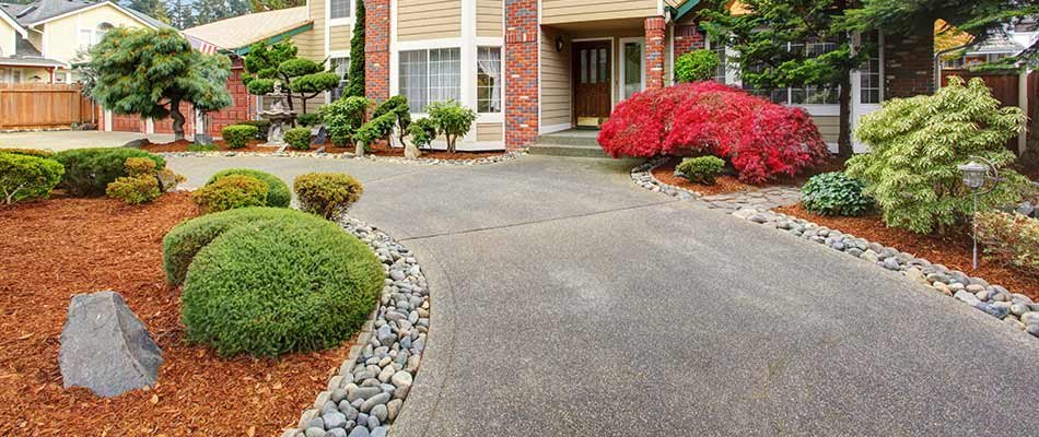 Mulch beds installed around a driveway near Elkhart, IN.