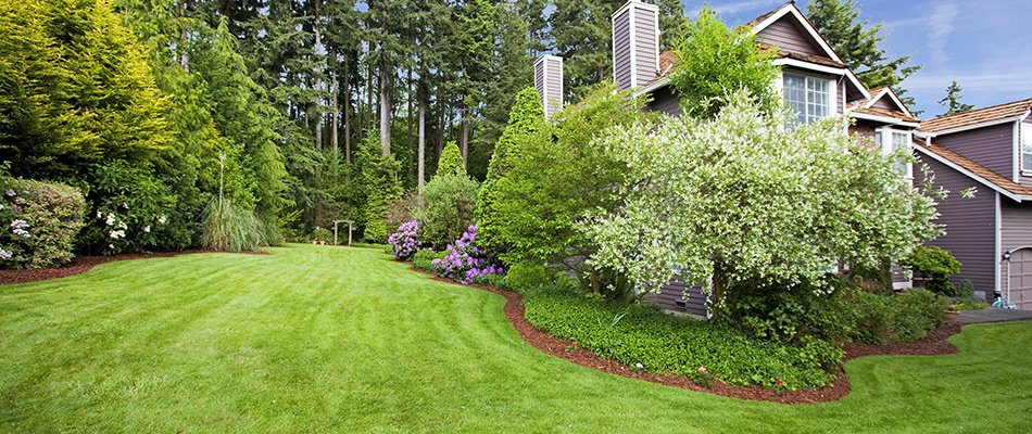 Freshly mowed grass and mulched landscape beds near Warsaw, IN.