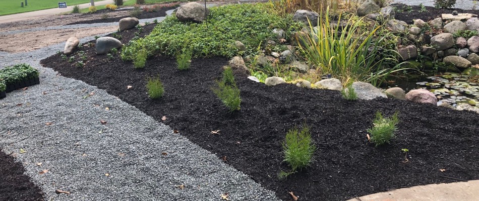 Mulch added to landscape bed in St. Joseph County, IN.