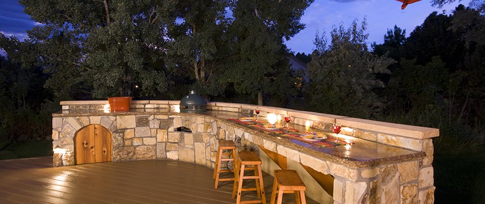 Outdoor kitchen made of stone with brick oven near Elkhart, IN.