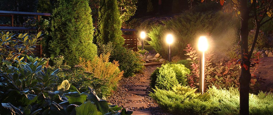 A walkway lit up in the evening with LED lighting behind a home in Roseland, IN.