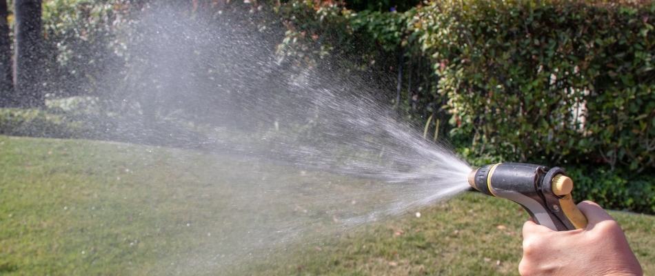 Water spraying a dried lawn due to drought in Granger, IN.